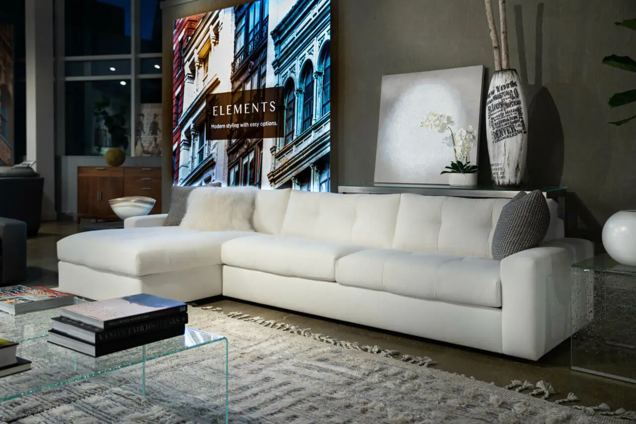 Montara-Vintage_Belgian_Cream__91856 white sofa chaise Montera by American Leather from Elements collection in a dimly lit moody room available in McAllen, TX at Niu Urban Living furniture store.