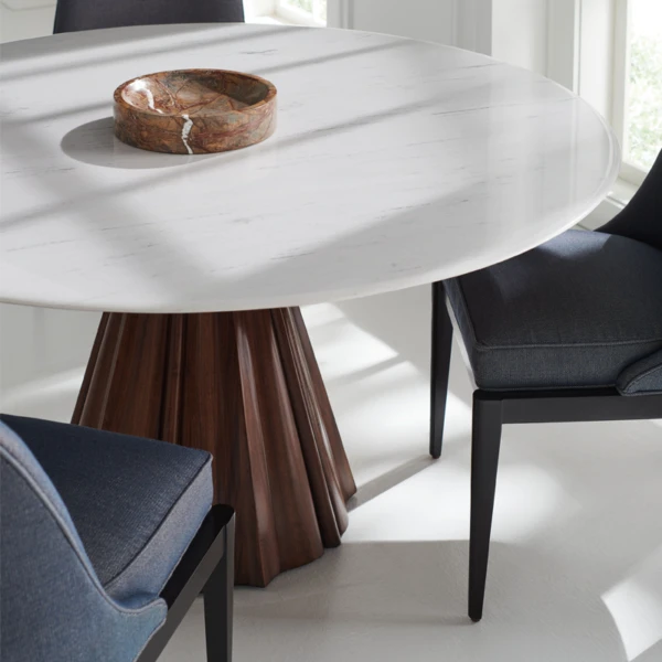 All Natural dining table close up image shows finishes marble top and wood base by Caracole