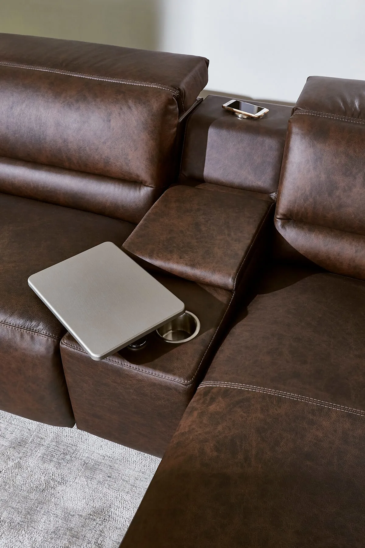 closeup of middle console with storage compartment closed and removable task table