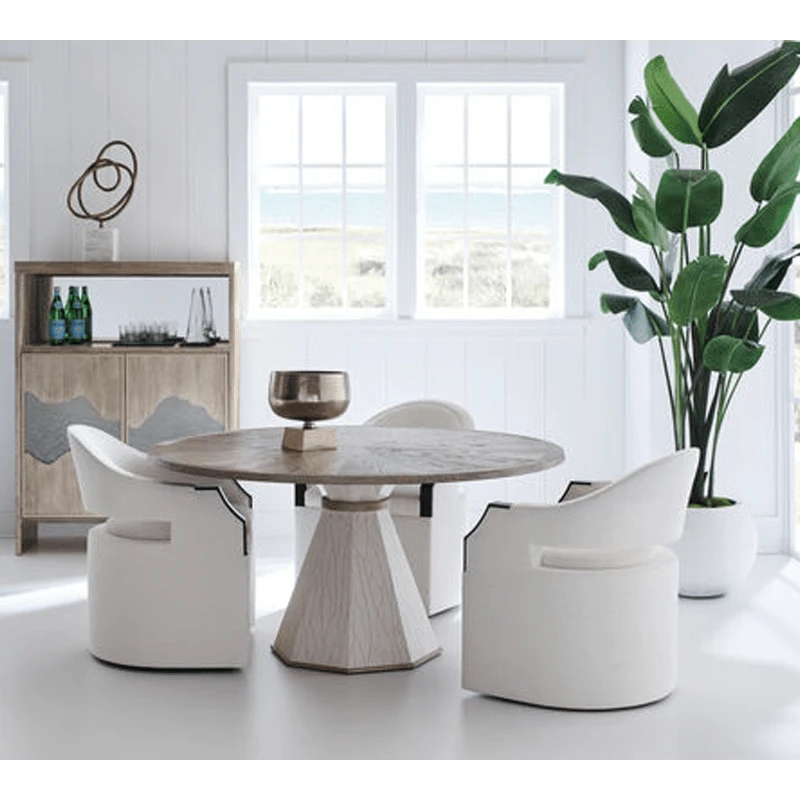 Dinner Roll chairs on a room shot with a dining table by Caracole