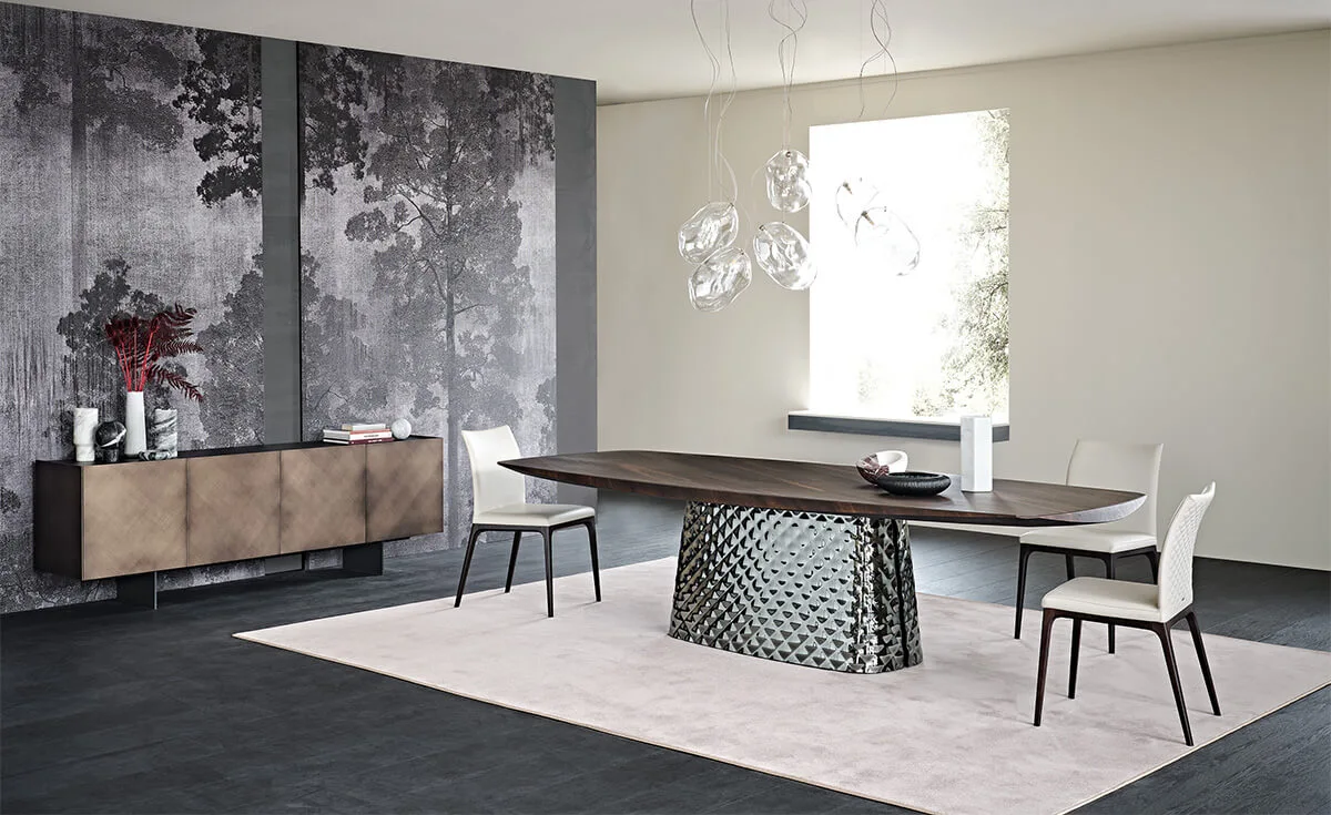 burned oak wooden carved top and metal quilted base in an empty room with white leather dining chairs