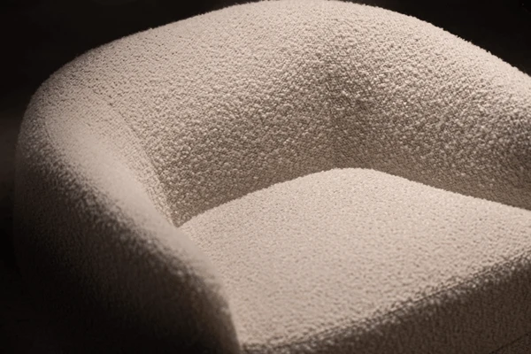 Berger chair in a cream fabric arm chair with curve and swivel product image closeup by American Leather