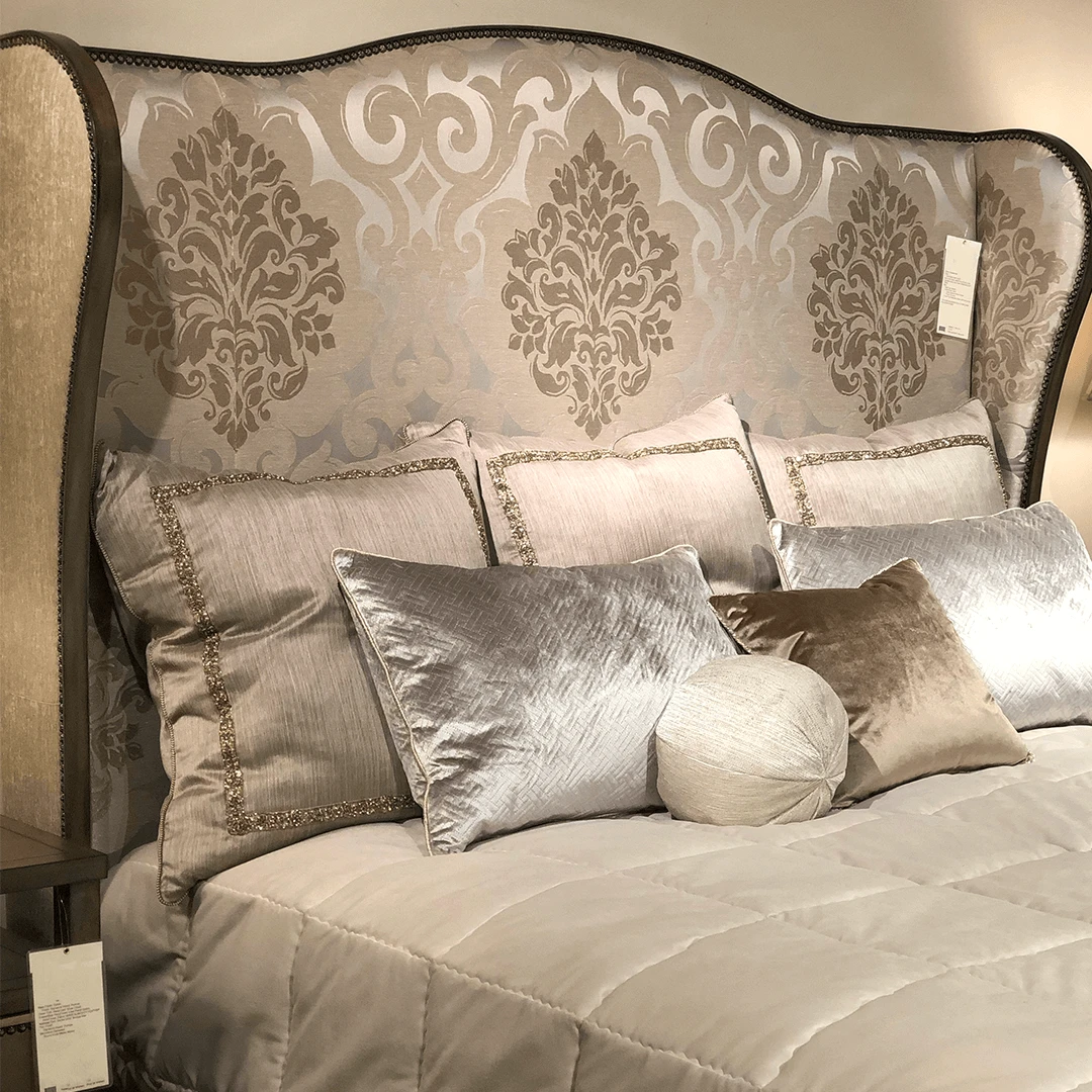 an example of the headboard with the plain tailored optioin in a designed fabric in neutral colors and a contrast dark wood finished trim