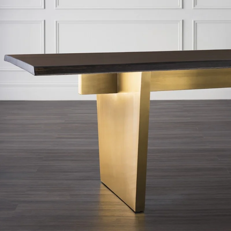 Aiden shown a close up of one side of dining table with finishes. by Nuevo Living