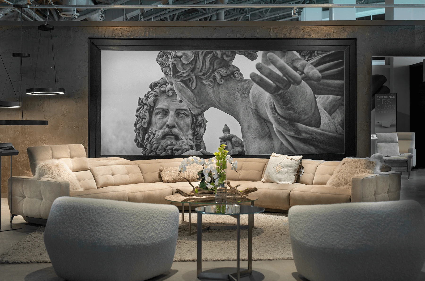 sectional setting with greek/roman style mural and two berger accent chairs