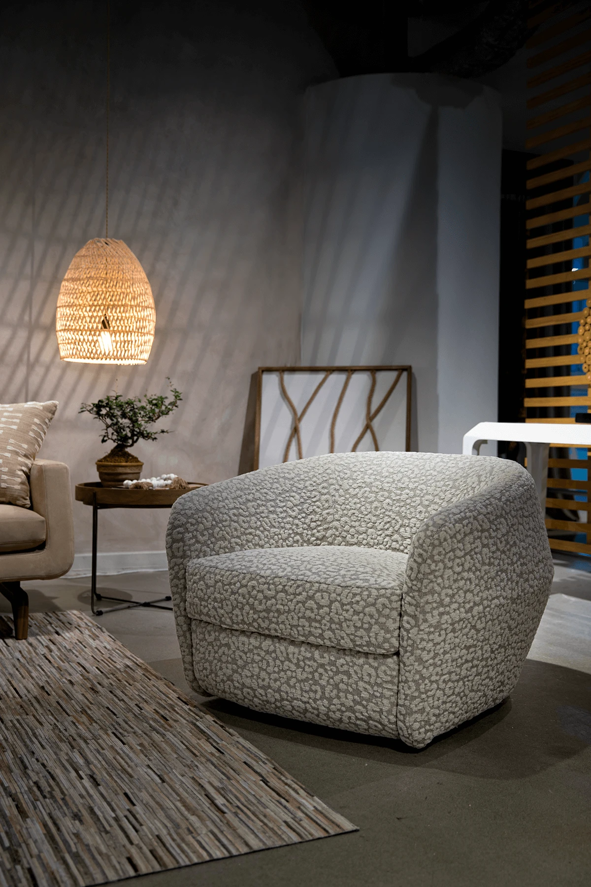 Berger accent chair in a cream fabric arm chair with curve and swivel product image staged by American Leather