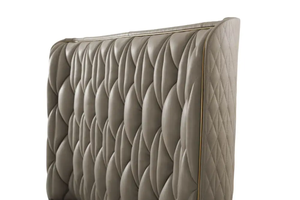 Quilted taupe leather king bed headboard.